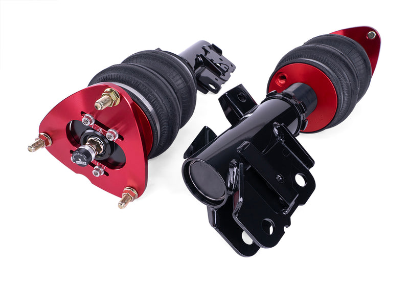 A pair of red and black Air Lift Performance air suspension shocks with double bellow air bags.