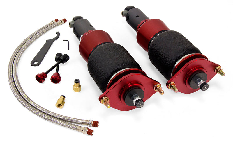 A pair of red and black Air Lift Performance red accented threaded body air-over shocks with progressive rate sleeve-style air springs, stainless steel leader hoses and fittings. 