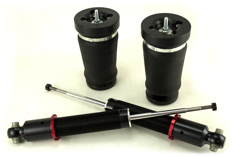 A pair of Air Lift Performance red accented monotube struts with progressive rate, tapered sleeve rear springs.  Air suspension part