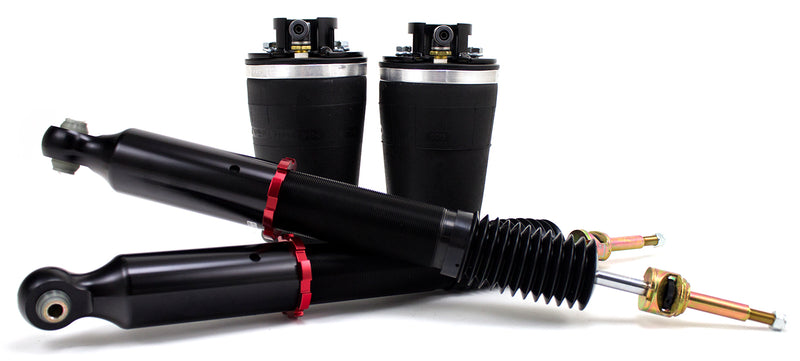 A pair of Air Lift Performance red accented threaded body shocks with progressive rate tapered sleeve style springs.  Air suspension kit part