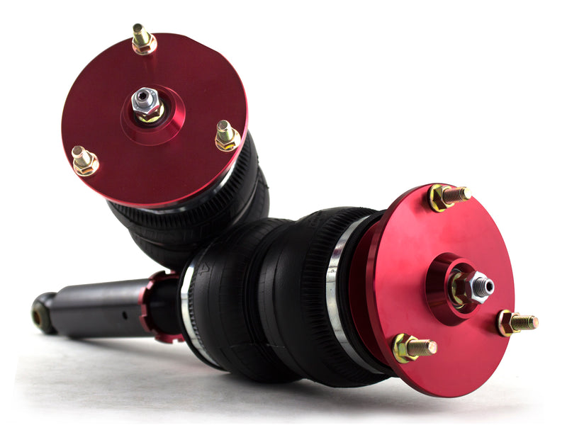 A pair of Air Lift Performance red accented monotube struts with double bellows progressive rate air springs with red anodized aluminum upper mounts. Air suspension kit part