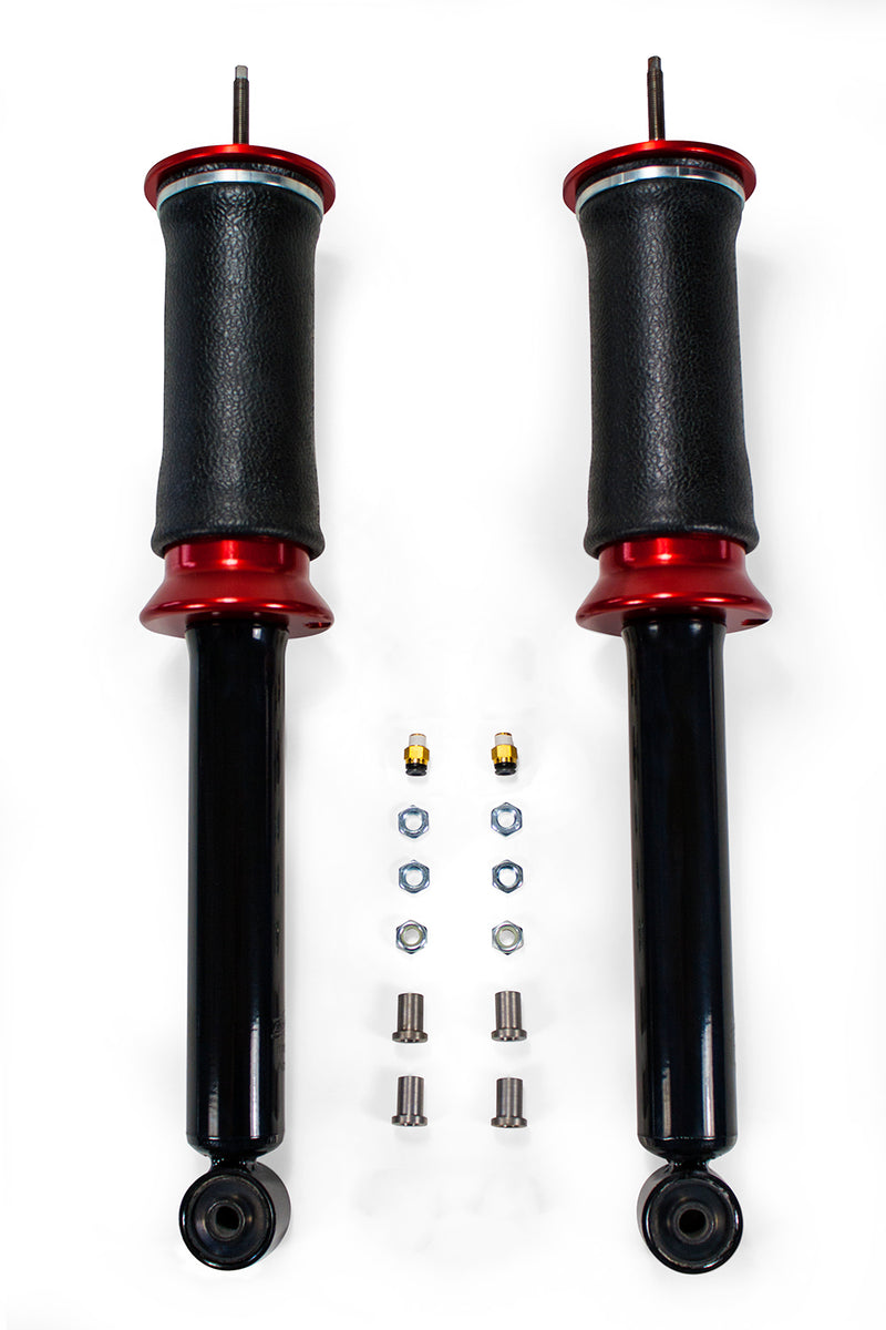 A pair of Air Lift Performance red accented air-over shocks and progressive rate sleeve-style air springs with performance valving, and mounting hardware. Air suspension kit part