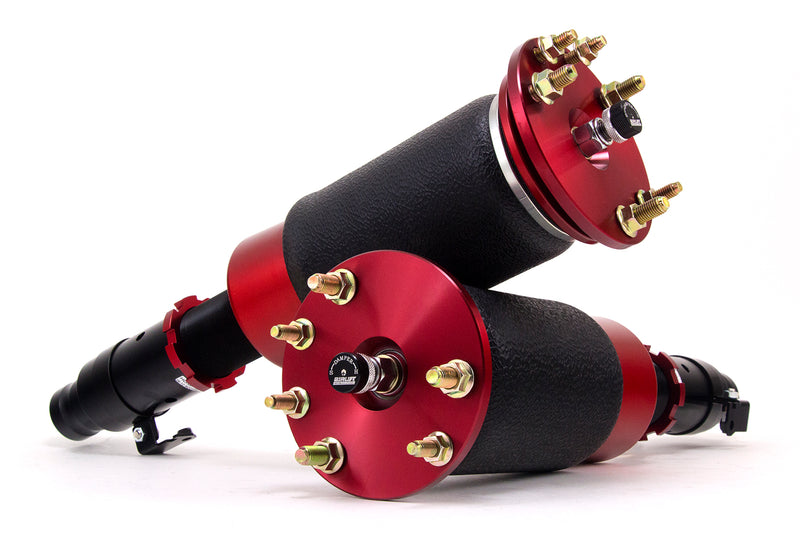 A pair of Air Lift Performance red accented threaded body air-over shocks with progressive rate sleeve-style air springs, air suspension kit part