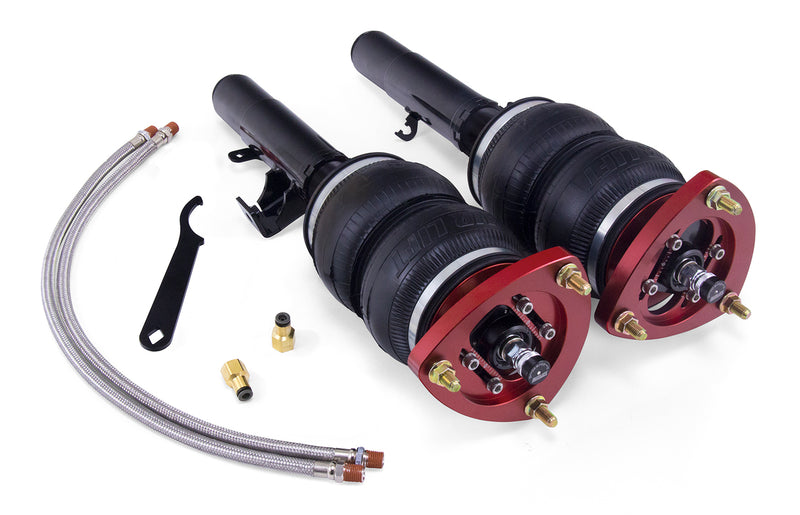 A pair of Air Lift Performance red accented air-over monotube struts with double bellows-style progressive rate air springs, leader hoses and fittings. Air suspension kit part