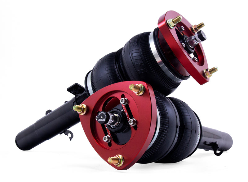 A pair of Air Lift Performance red accented air-over monotube struts with double bellows-style progressive rate air springs. Air suspension kit part