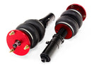 A pair of red accented monotube struts with double bellows progressive rate air springs.  Air suspension kit part
