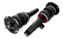 A pair of Air Lift Performance threaded body over-air struts with compact double bellows progressive rate air springs with bolt-in camber plates. Air suspension kit part