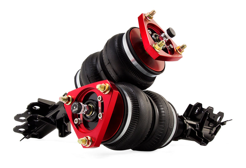 A pair of Air Lift Performance red accented high performance monotube struts with double bellows progressive rate air springs with bolt-in camber plates, sway bar endlinks and black steel mounting brackets. Air suspension kit part
