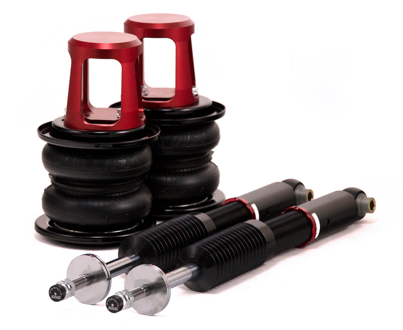 A pair of Air Lift Performance red accented threaded monotube struts and double bellows progressive rate air springs with remote damping extenders.  Air suspension kit part