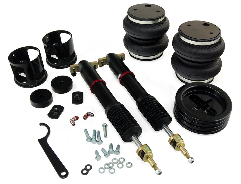 A pair of Air Lift Performance red accented monotube shocks with double bellows progressive rate air springs and roll plates. Mounting hardware and fittings. Air suspension kit part