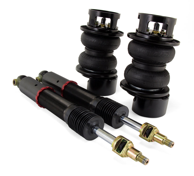 A pair of Air Lift Performance red accented threaded monotube struts with black accented double bellows progressive rate air springs and roll plates. Air suspension part