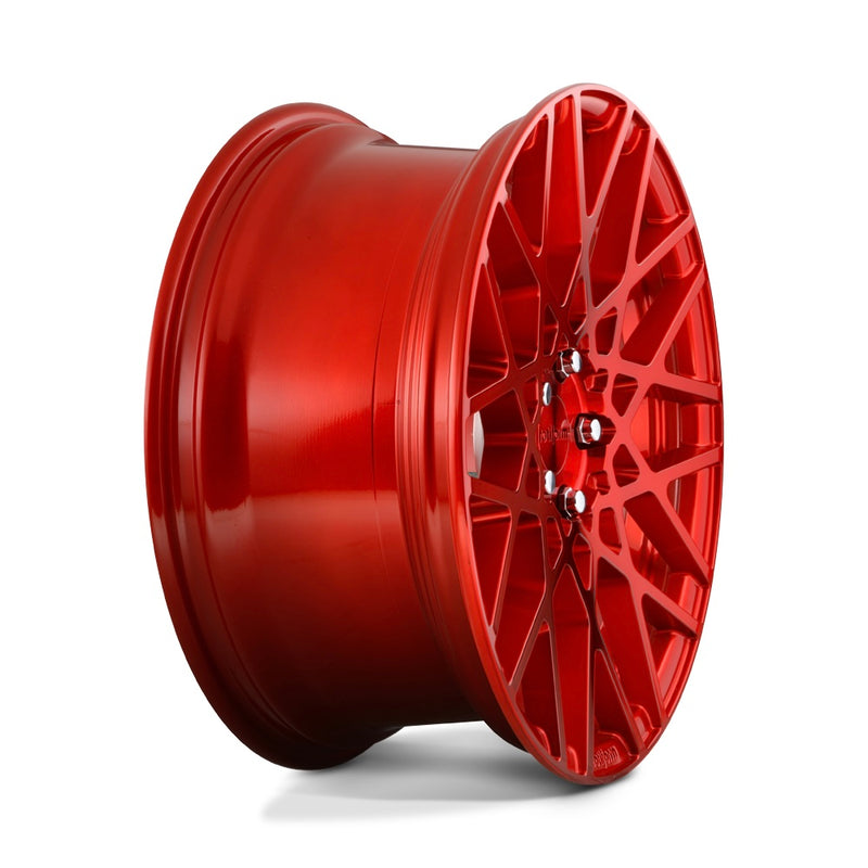 Side view of a Rotiform BLQ monoblock cast aluminum 10 spoke mesh pattern automotive wheel in a candy red finish with an embossed Rotiform logo on the lip and a red Rotiform logo center cap.