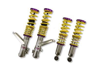 4 vehicle suspension chrome coilovers with yellow springs and purple accented fitments.