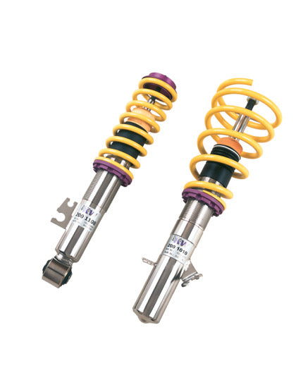2 vehicle suspension chrome coilovers with yellow springs and purple accented fittings.
