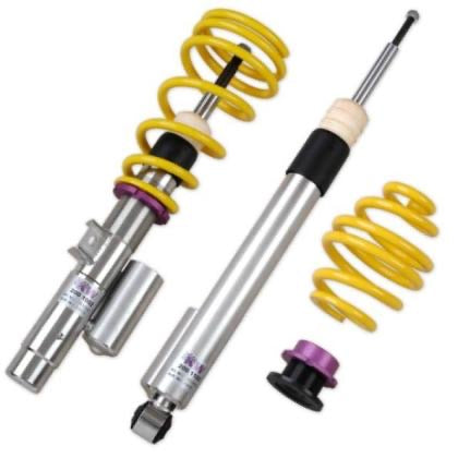 1 chrome body coilover with yellow spring, 1 chrome body coilover and 1 yellow spring with black and purple fitting.