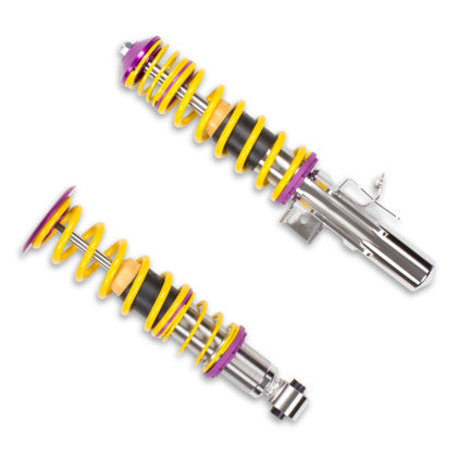2 assembled vehicle suspension chrome coilovers with yellow springs and purple fittings.