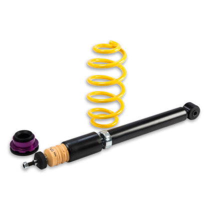 1 black vehicle suspension coilover, 1 yellow spring and 1 purple fitting.