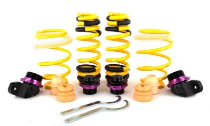 4 yellow height adjustable vehicle suspension springs and adjustment fittings