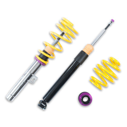 1 vehicle suspension chrome coilover with yellow spring, 1 black coilover and 1 yellow spring with 2 purple accented adjuster fitting.