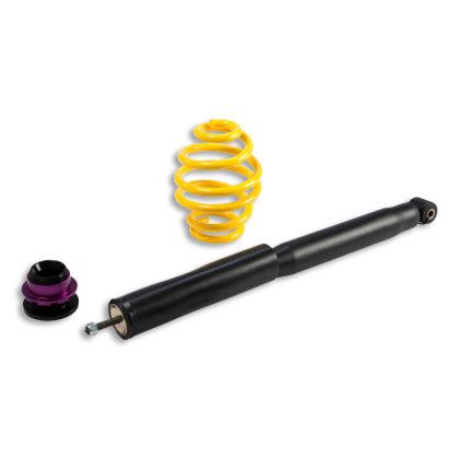 1 black body coilover with 1 yellow spring and 1 black and purple fitting.