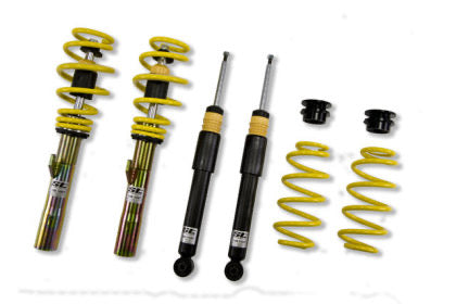 Two assembled adjustable coilovers, two unsleeved coilover black struts and two yellow coilover springs with end fittings