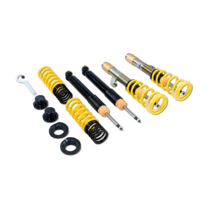 Vehicle adjustable coilover kit with two assembled coilovers, two struts and two lowering springs with end caps and tools