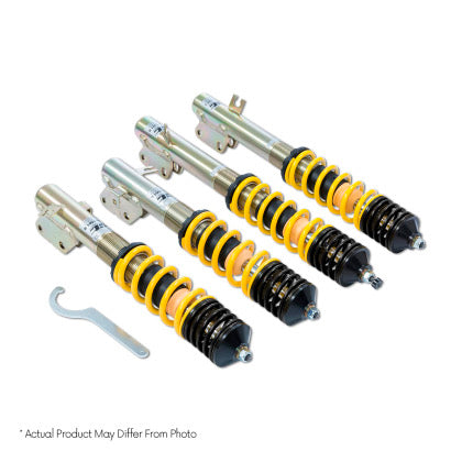 Four vehicle suspension adjustable yellow and black coilovers