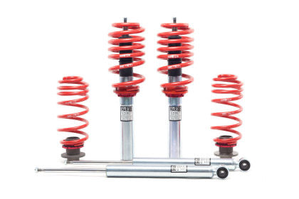 2 assembled vehicle suspension coilovers along with 2 shock bodies and 2 red springs