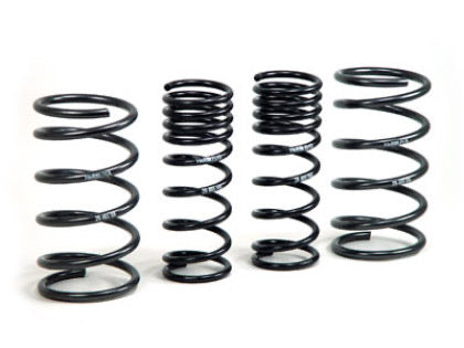4 black vehicle suspension lowering springs,