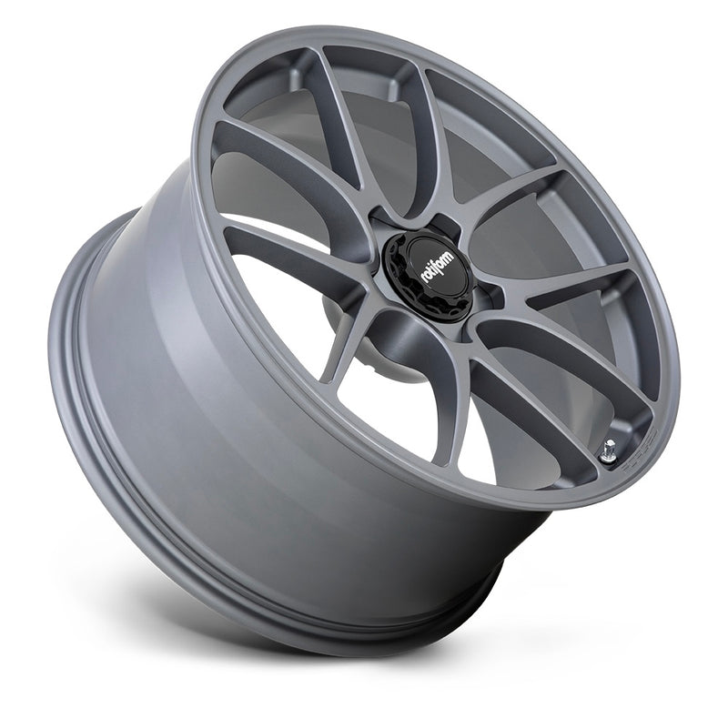 Tilted Side View of Rotiform's 21" LTN Model, A Monoblock Forged Aluminum 5 V Shape Spoke Wheel In A Satin Titanium Finish With The Word Forged Embossed On The Bead Ring