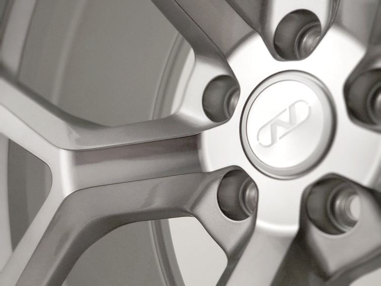 Close of of spokes on a Neuspeed lightweight 10 spoke automotive alloy wheel in a silver platinum finish.