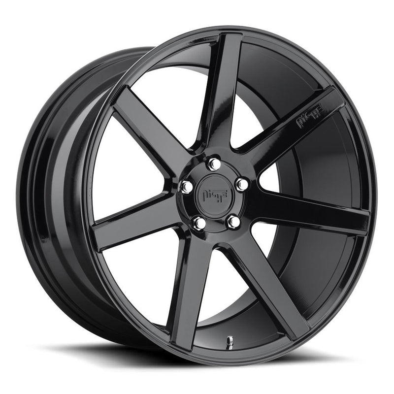 Niche Verona monoblock cast aluminum 7 smooth spoke automotive wheel in a gloss black finish with an embossed Niche logo on one spoke and a Niche black logo center cap.