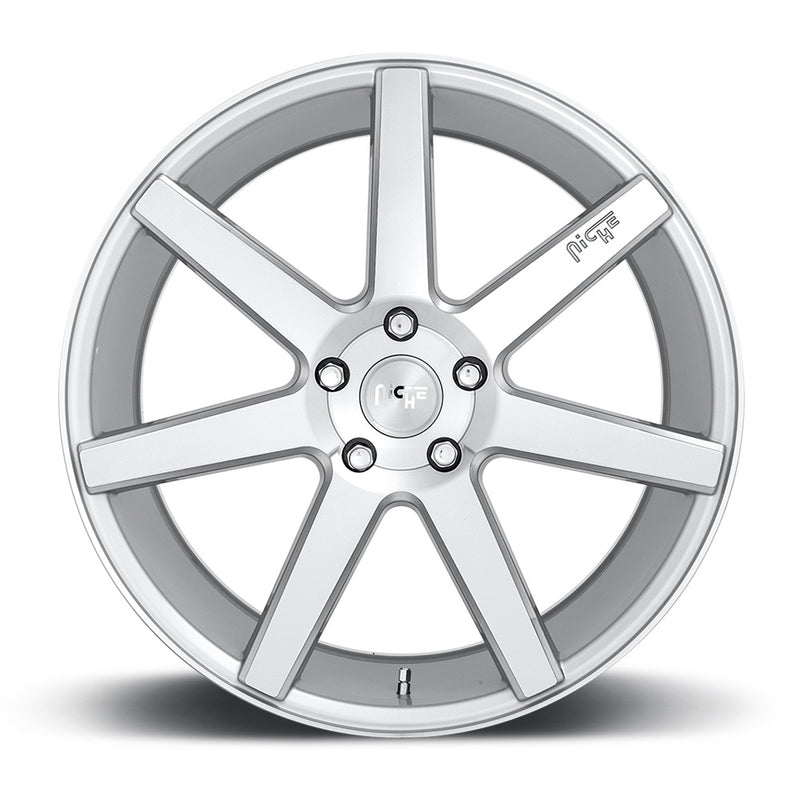 Front face of a Niche Verona monoblock cast aluminum 6 spoke automotive wheel in a gloss silver machined finish with an embossed Niche Logo on one spoke and a Niche logo center cap.