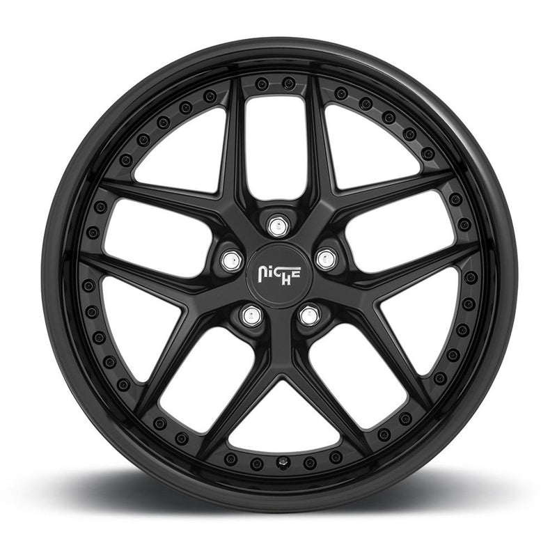 Front face view of a Niche Vice monoblock cast aluminum 5 Y spoke design automotive wheel in a gloss black matte black finish with a stud pattern around the bead ring and a Niche silver logo center cap.