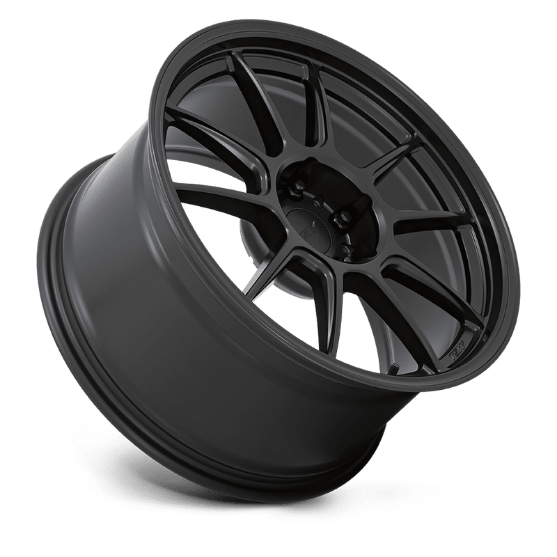 Tilted side view of a TSW Imatra aluminum split 5 spoke automotive wheel with a deep recessed lug bowl in a matte black finish with a TSW logo center cap.