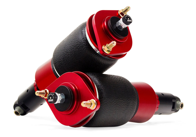 A pair of red and black Air Lift Performance red accented threaded body air-over shocks with progressive rate sleeve-style air springs.  