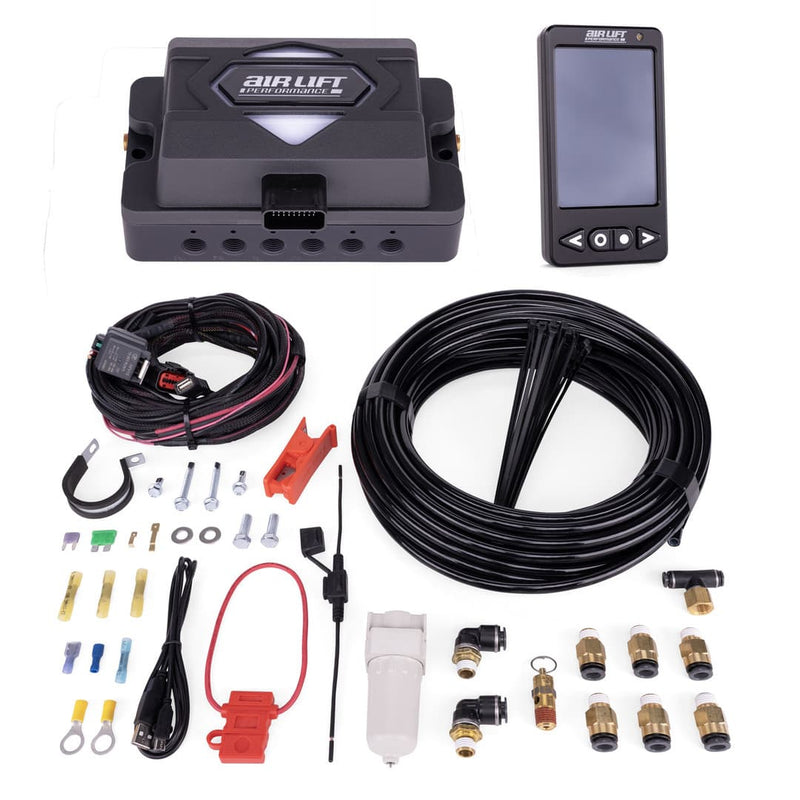 Air Lift Performance kit with manifold box, digital controller, wiring harness, and various components on a white background