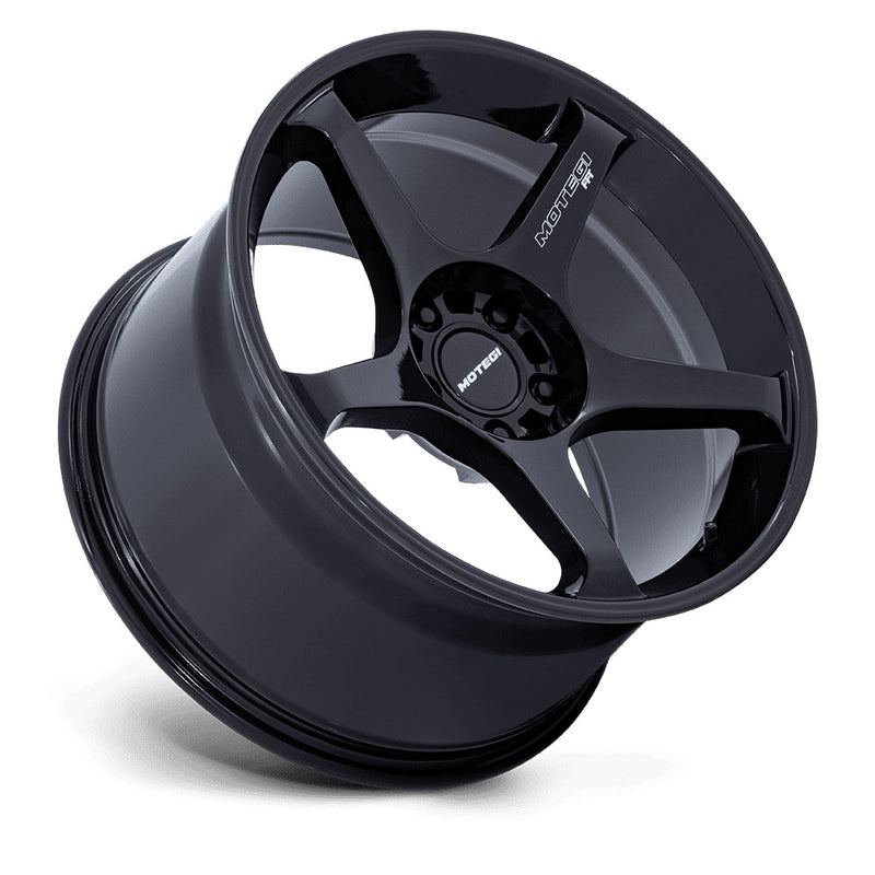 Tilted side view of  5 spoke aluminum automotive wheel in a black finish with Motegi Racing logo black center cap