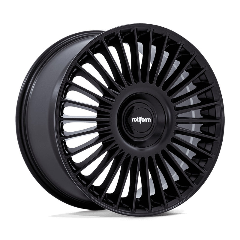 Rotiform multispoke flat face vehicle wheel in a matte black finish with black and silver Rotiform logo center cap.