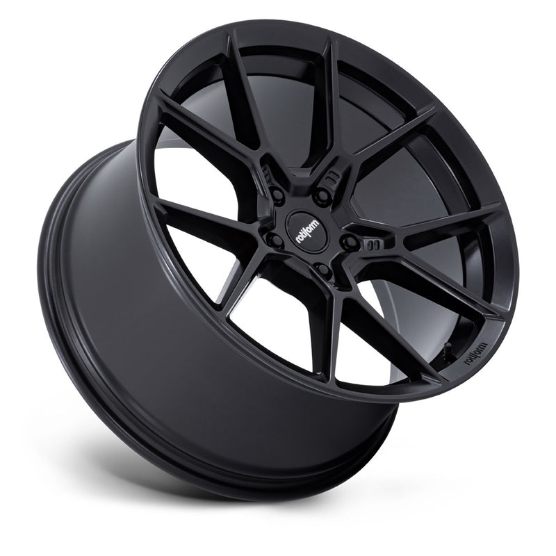 Tilted side view of a Rotiform KPR Satin Black Car Wheel with black center cap with silver Rotiform logo.
