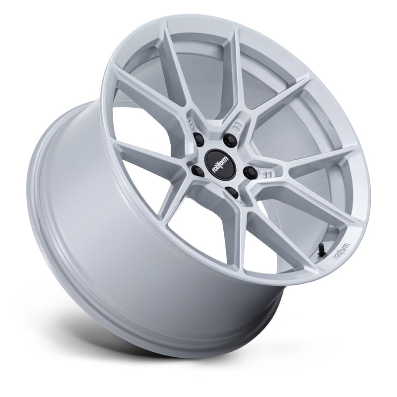 Tilted side view of a Rotiform KPR Silver Automotive Wheel with black center cap with silver Rotiform logo and 5 black lug bolts.