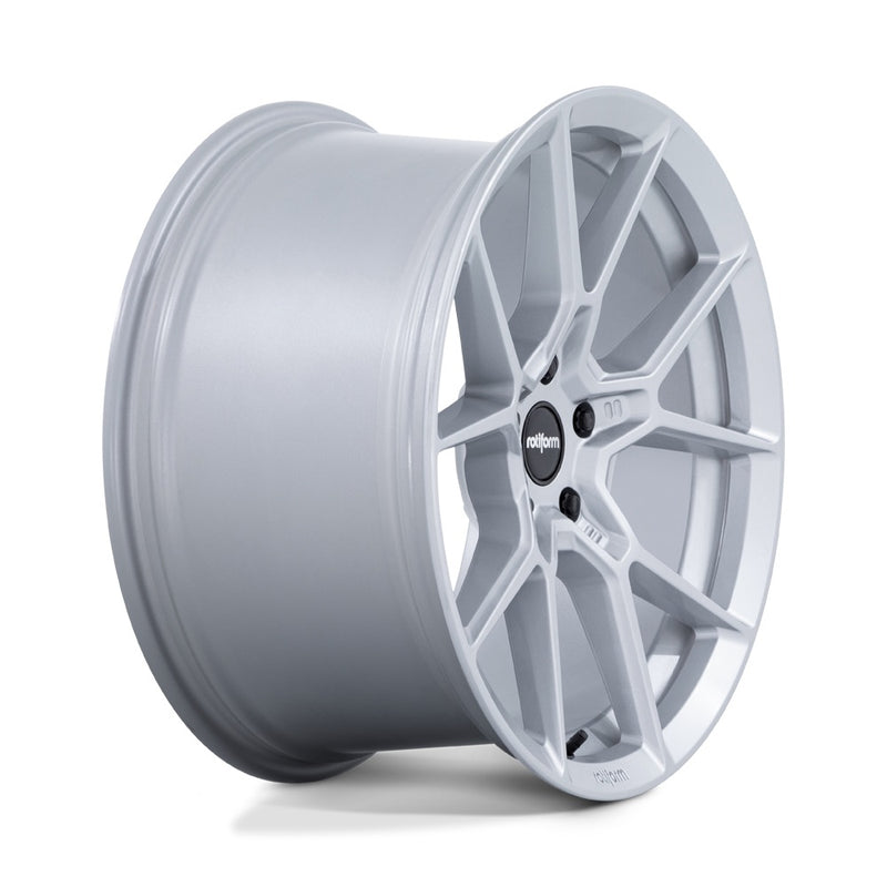 Side view of a Rotiform KPR Silver Automotive Wheel with black center cap with silver Rotiform logo and 5 black lug bolts.
