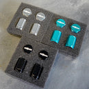 Rotiform valve end caps in black, teal and silver with Rotiform logo on each cap.