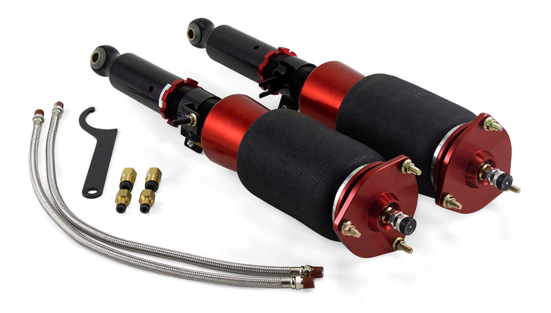 A pair of Air Lift Performance red accented threaded body air-over shocks with progressive rate sleeve-style air springs along with stainless steel leader hoses and fittings. Air suspension kit part