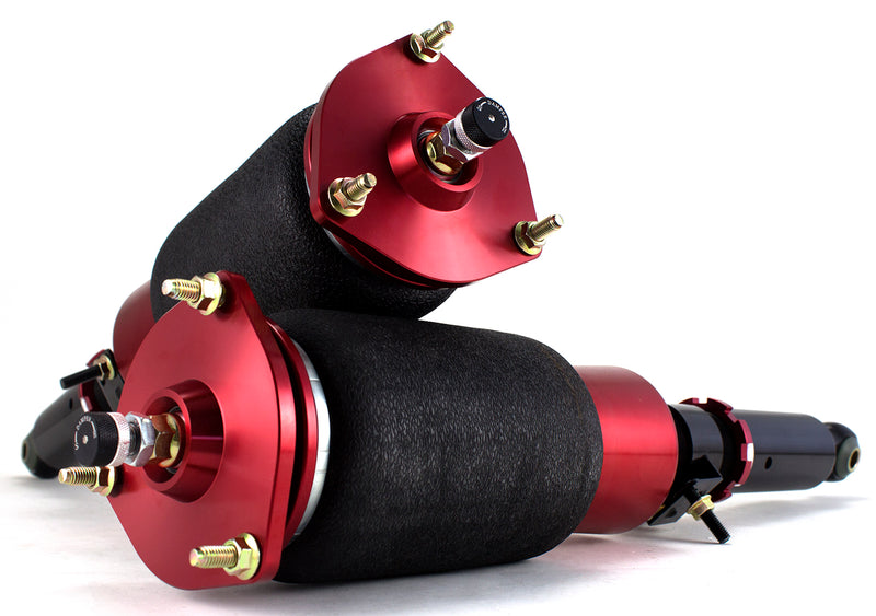 A pair of Air Lift Performance red accented threaded body air-over shocks with progressive rate sleeve-style air springs.  Air suspension kit part