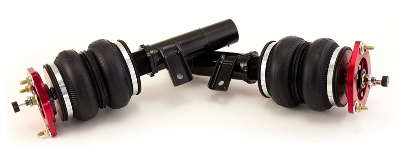 A pair of Air Lift Performance anodized red aluminum accented threaded body air-over monotube shocks with double bellows progressive rate air springs, adjustable front camber plates and powdercoated gloss black steel brackets.  Air suspension kit part