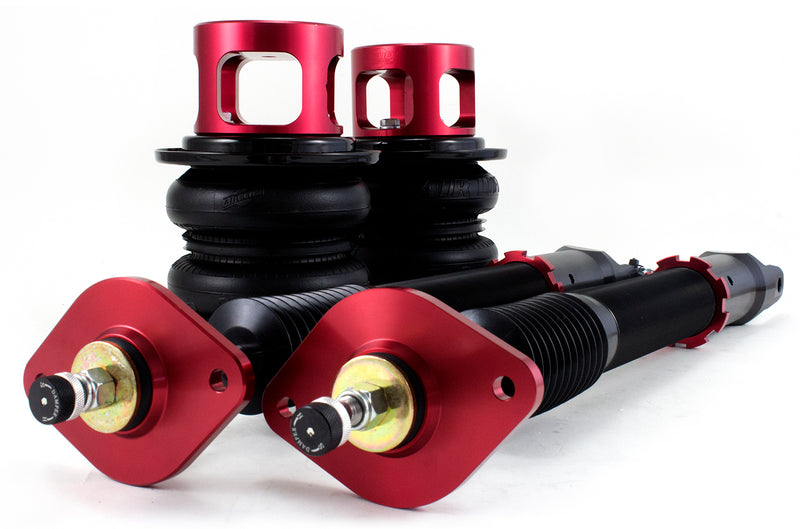 A pair of Air Lift Performance red accented monotube struts and double bellows progressive rate air springs with red anodized aluminum upper mounts and roll plates.  Air suspension kit part