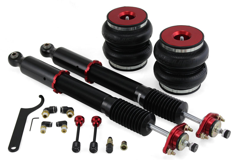 A pair of Air Lift Performance red accented high performance monotube shocks, double bellows progressive rate air springs with red anodized aluminum upper mounts and fittings. Air suspension kit part