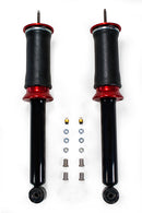 A pair of Air Lift Performance red accented air-over shocks and progressive rate sleeve-style air springs with performance valving, and mounting hardware. Air suspension kit part