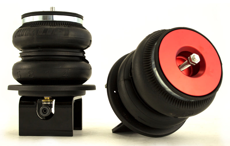 A pair of Air Lift Performance red accented double bellows progressive rate air springs with roll plates and  gloss black steel brackets.  Air suspension kit part